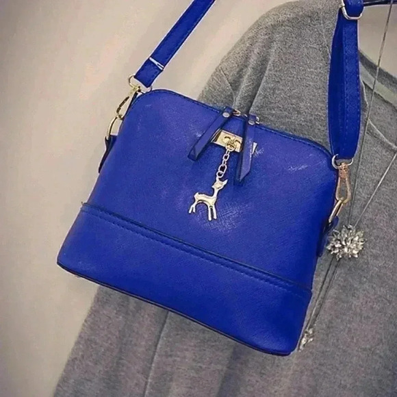 SMALL BLUE CROSSBODY WITH DEER CHAIN - Picture 1 of 4
